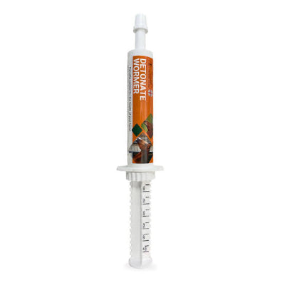 White syringe with a brown and white label on a white background